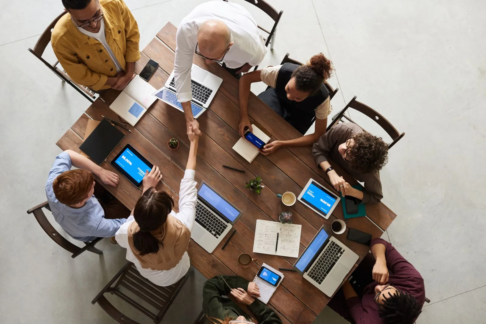 Editors and policy researchers reviewing documents around a meeting table
