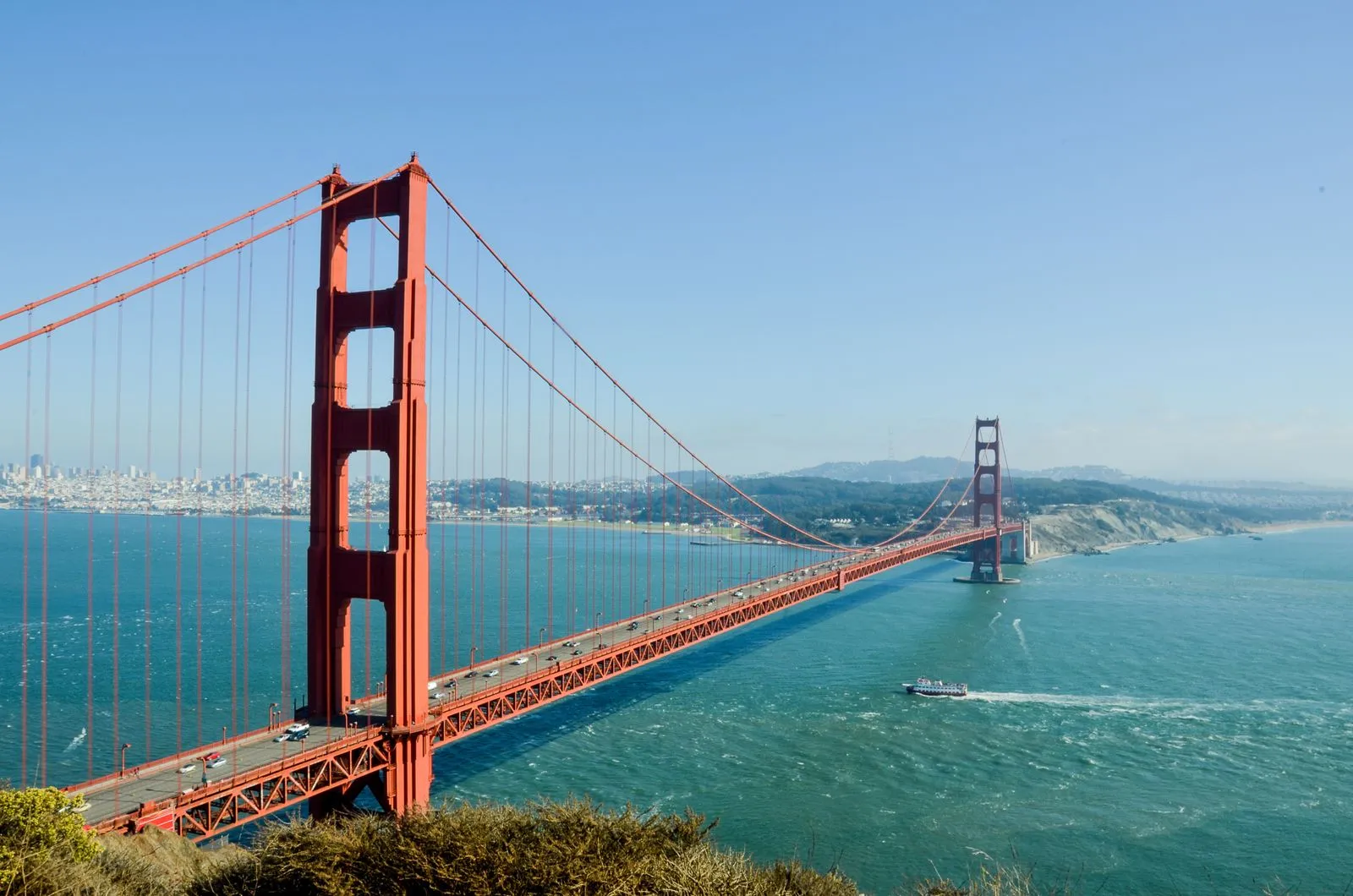 The Golden Gate Bridge stretching across blue water