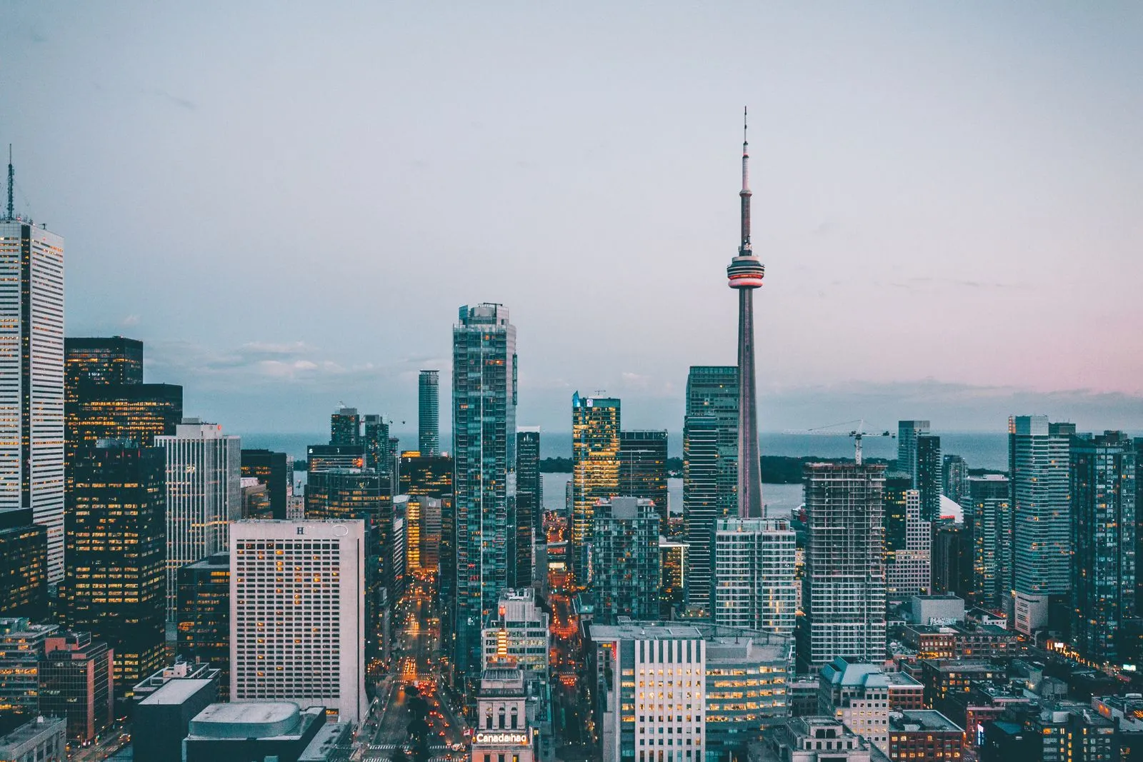 The Toronto skyline at dusk with the CN Tower visible